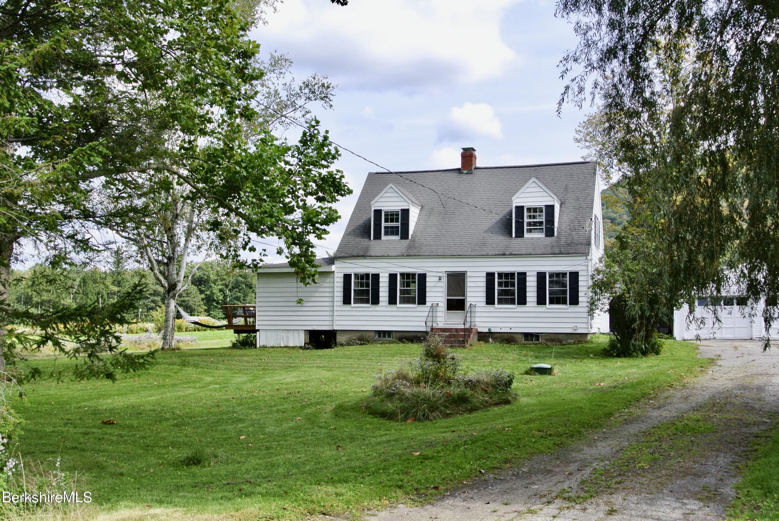 105 Yokun Road Richmond, MA 01201 - Photo 2 of 37 a house view with a garden space