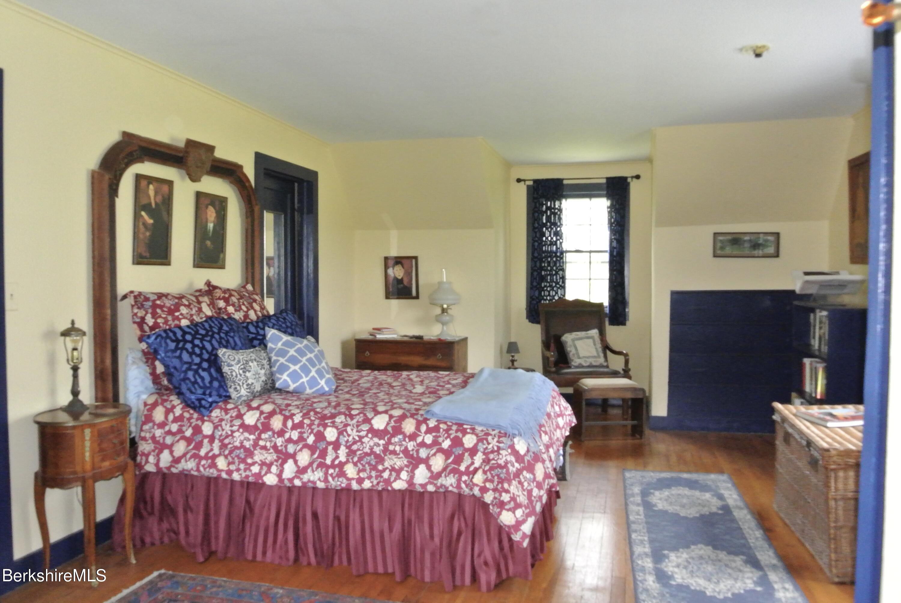 105 Yokun Road Richmond, MA 01201 - Photo 23 of 37 a bedroom with a large bed and a couch