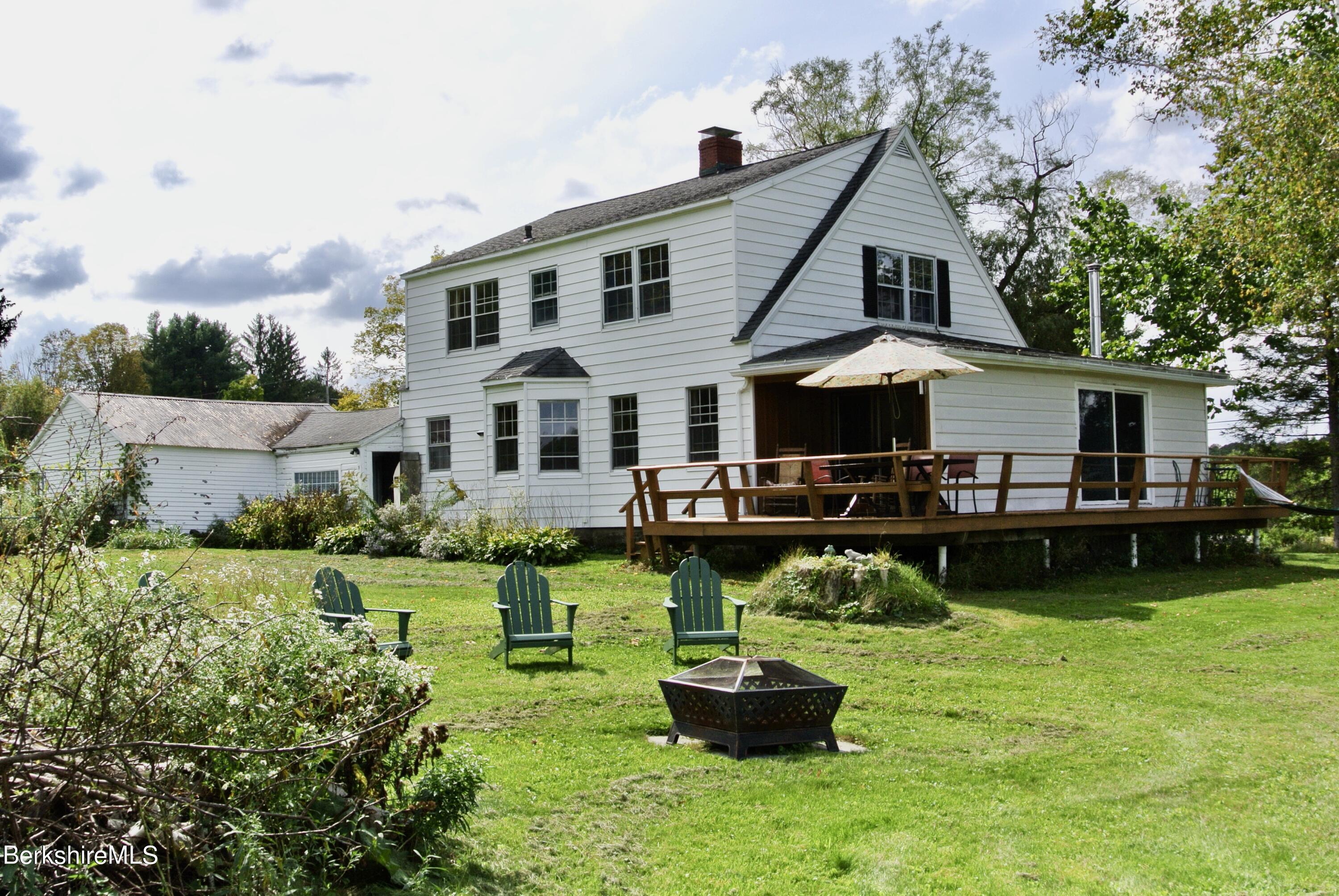 105 Yokun Road Richmond, MA 01201 - Photo 34 of 37 a front view of a house with garden