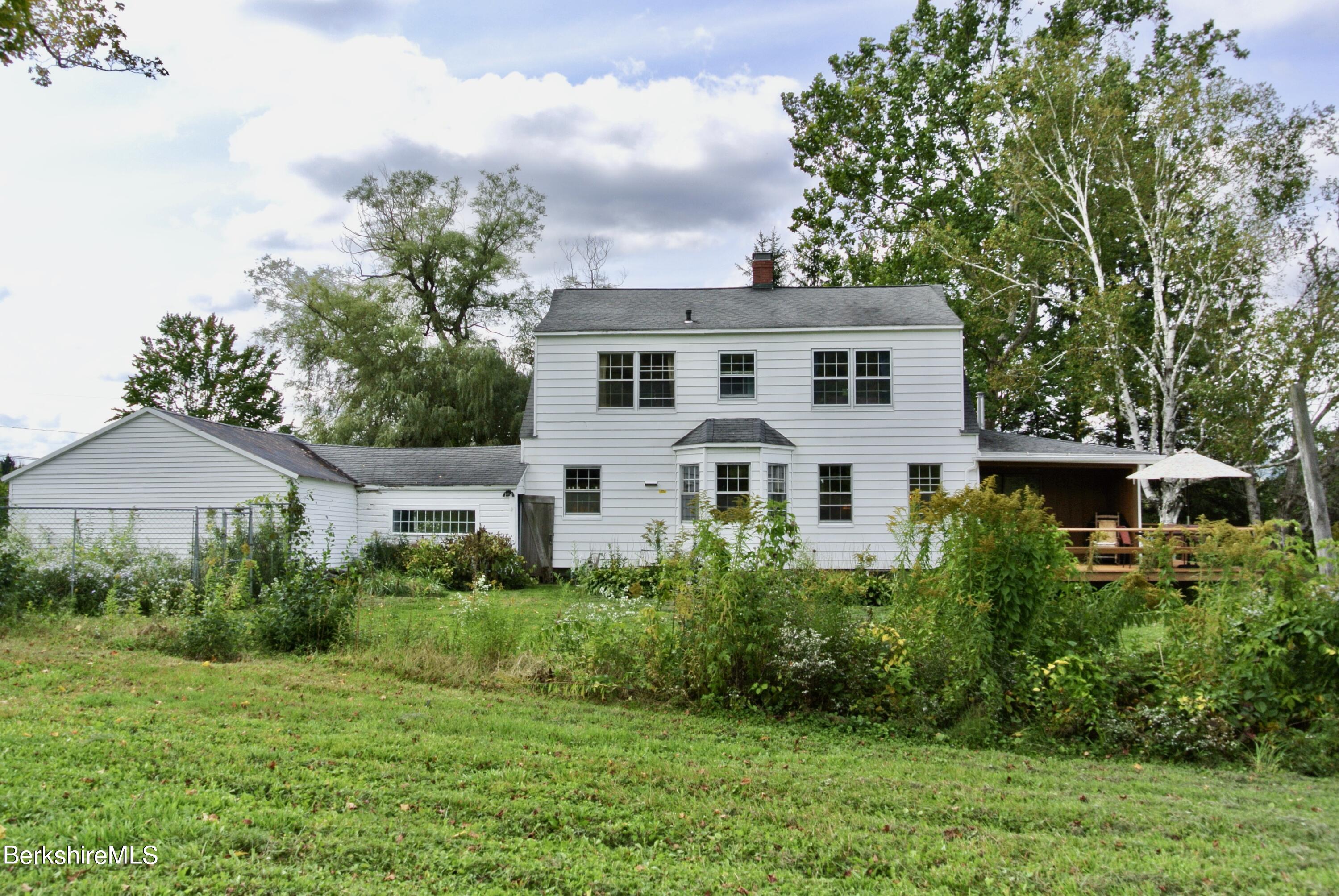 105 Yokun Road Richmond, MA 01201 - Photo 35 of 37 a front view of a house with a yard