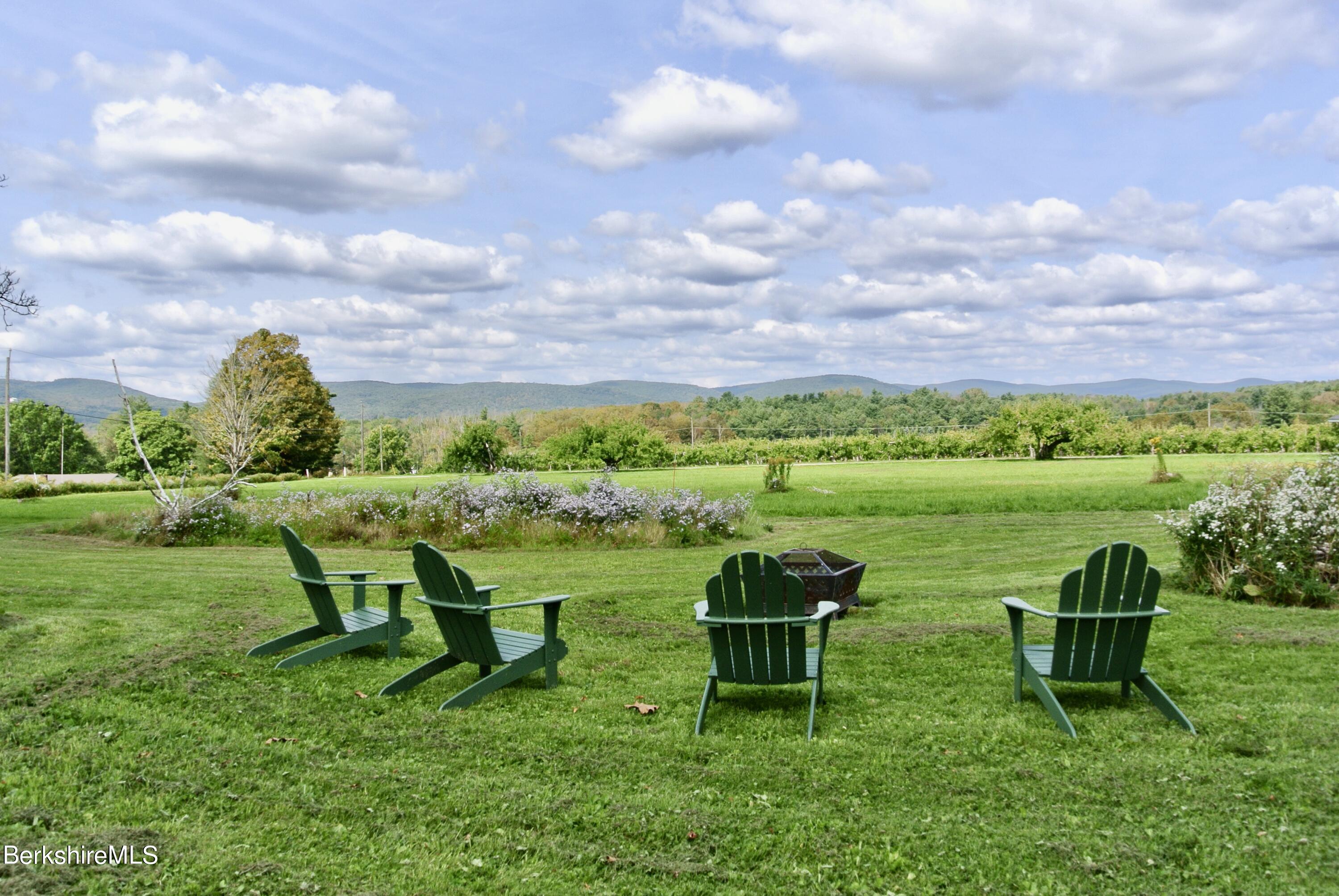 105 Yokun Road Richmond, MA 01201 - Photo 6 of 37 a view of a garden with chairs