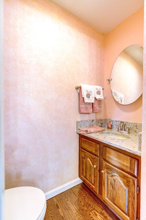 138 Quincy Shore Drive, Unit 170 Quincy, MA 02171 - Photo 18 of 41 a bathroom with a toilet a sink and mirror