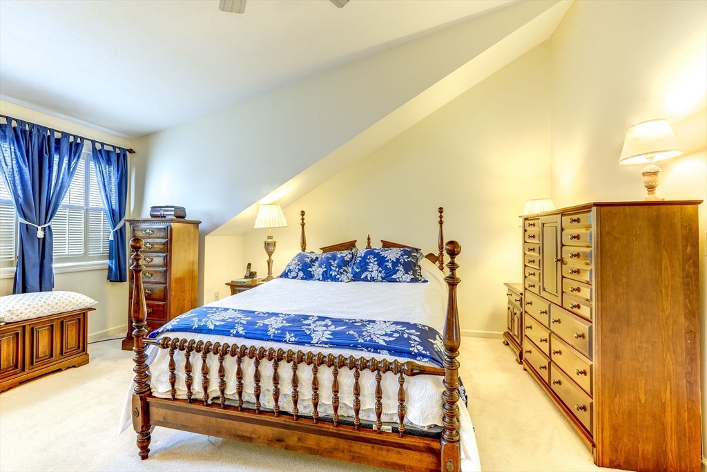 138 Quincy Shore Drive, Unit 170 Quincy, MA 02171 - Photo 30 of 41 a bedroom with a bed window and a night stand