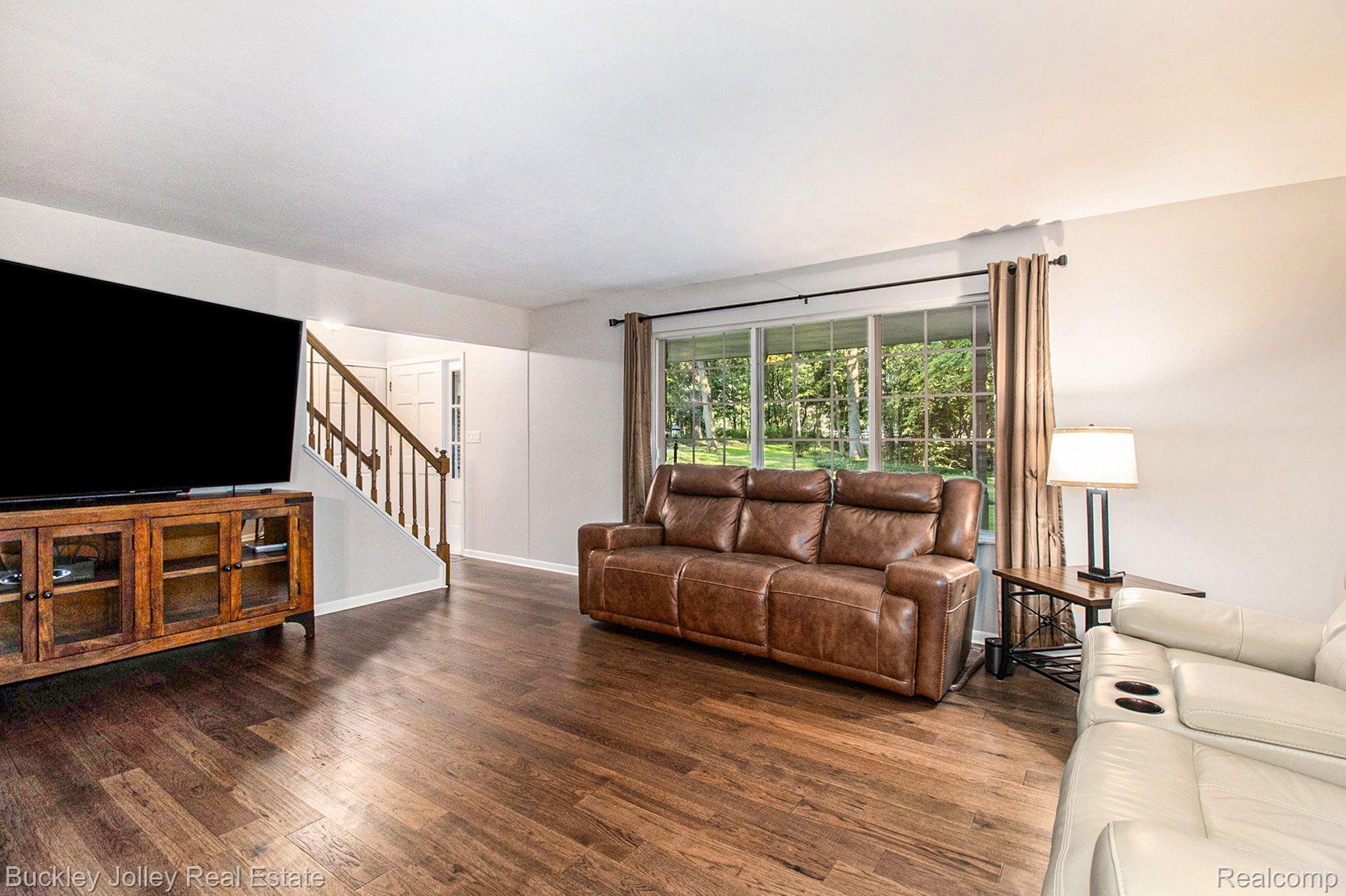 6399 Brighton Road Brighton, MI 48116 - Photo 18 of 36 Beautiful Wood Flooring Greets You