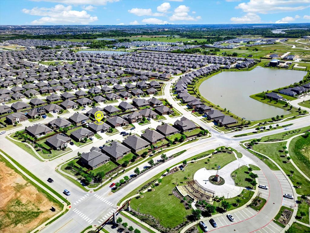 2816 Permian Road Aubrey, TX 76227 - Photo 30 of 36 Aerial perspective of suburban area with a large body of water