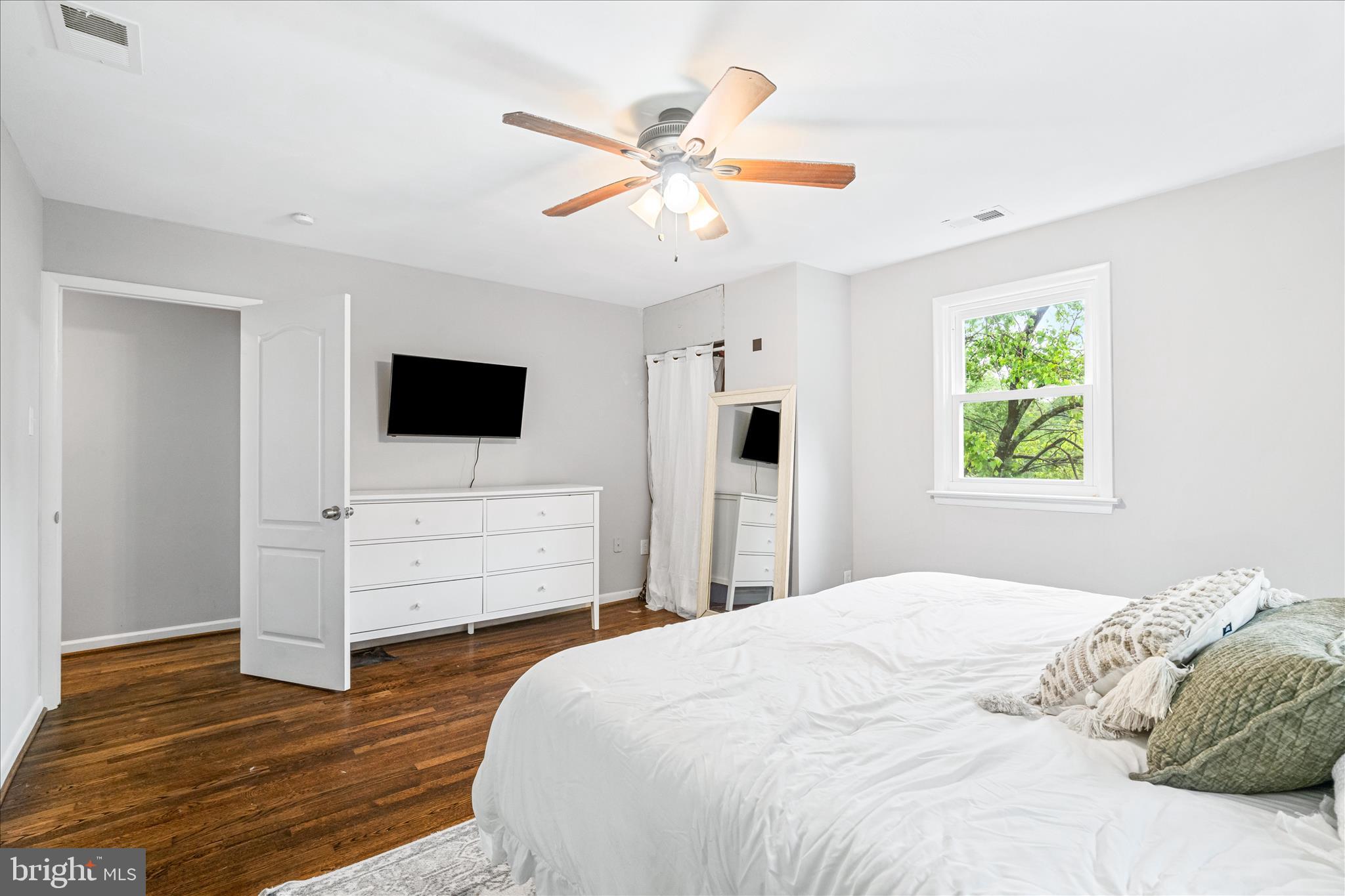 4217 Bill Moxley Road Mount Airy, MD 21771 - Photo 26 of 57 a bedroom with a bed and a flat screen tv