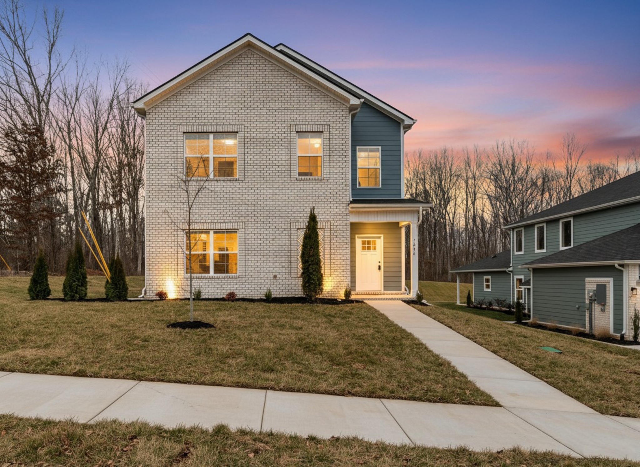 a front view of a house with a yard