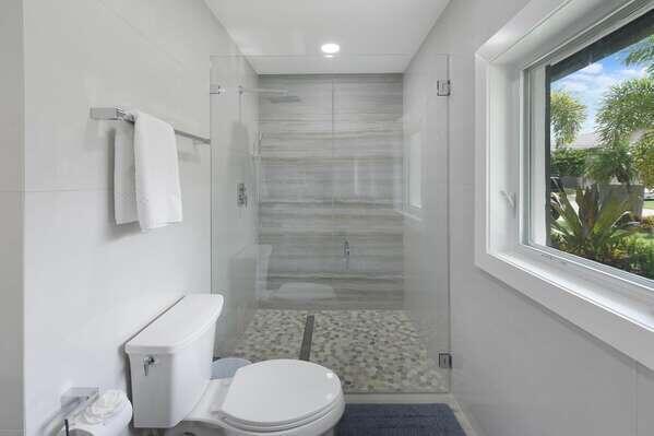 839 Enfield Street Boca Raton, FL 33487 - Photo 11 of 36 a white toilet sitting next to a bathroom sink