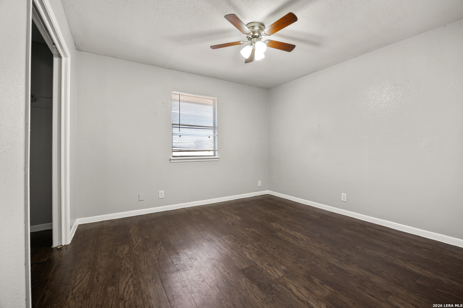 218 Merida Street, Unit 1 San Antonio, TX 78207 - Photo 1 of 1 an empty room with wooden floor and windows