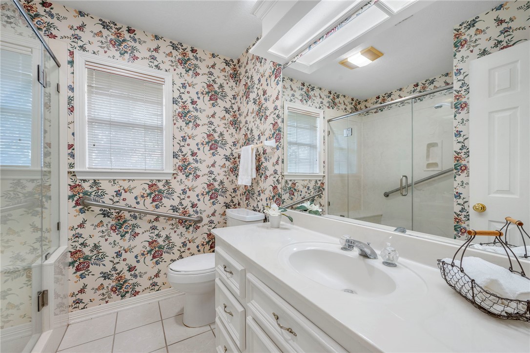 713 Willow Loop College Station, TX 77845 - Photo 27 of 39 a bathroom with a sink toilet and shower