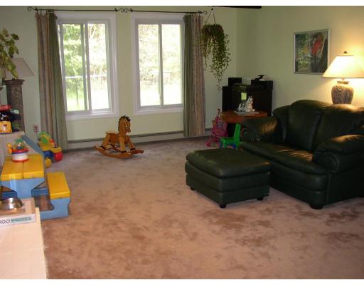 10 Common Street Norwell, MA 02061 - Photo 13 of 27 a living room with furniture and a fireplace