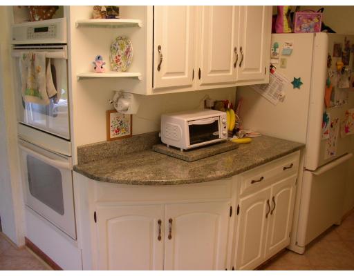 10 Common Street Norwell, MA 02061 - Photo 15 of 27 a kitchen with stainless steel appliances granite countertop a refrigerator and a stove