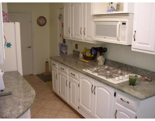 10 Common Street Norwell, MA 02061 - Photo 16 of 27 a kitchen with stainless steel appliances granite countertop a sink stove and cabinets
