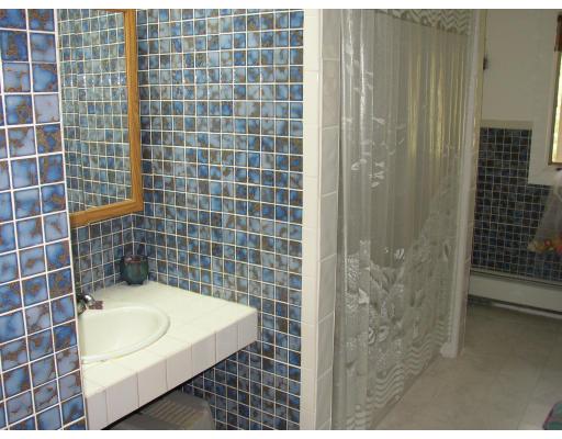 10 Common Street Norwell, MA 02061 - Photo 25 of 27 a bathroom with a sink and a shower