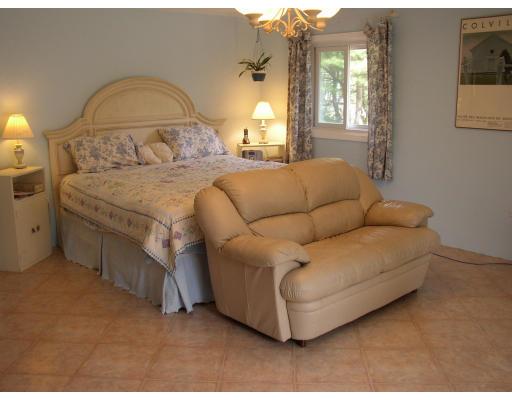 10 Common Street Norwell, MA 02061 - Photo 26 of 27 a living room with a couch and chandelier