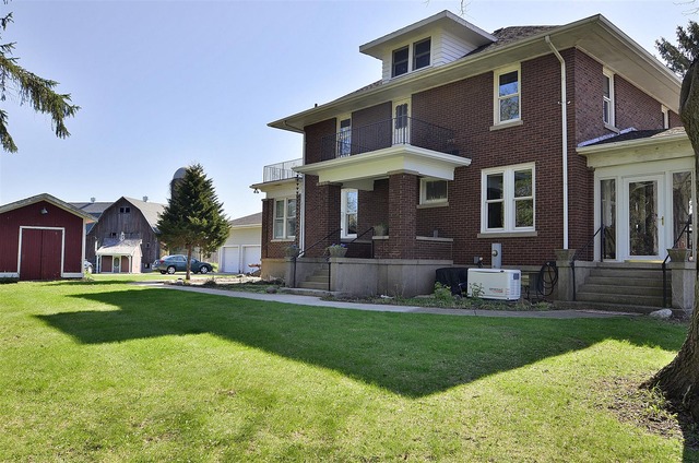 43W424 Burlington Road Elgin, IL 60124 - Photo 2 of 25 a front view of a house with a yard