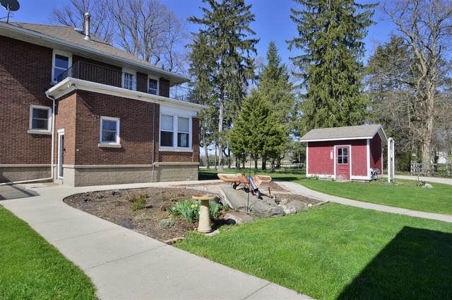 43W424 Burlington Road Elgin, IL 60124 - Photo 19 of 25 a view of a house with a yard