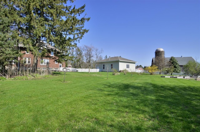 43W424 Burlington Road Elgin, IL 60124 - Photo 22 of 25 a view of a house with a yard