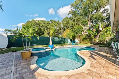 a view of a swimming pool with a patio