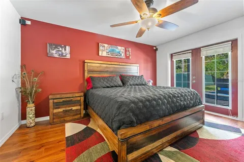 a bedroom with a bed and a window