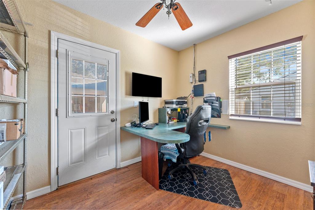 1441 Santa Anna Drive Dunedin, FL 34698 - Photo 20 of 34 a view of a workspace with furniture and a window