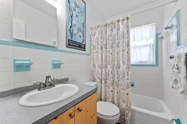 a bathroom with a sink a toilet and a bathtub