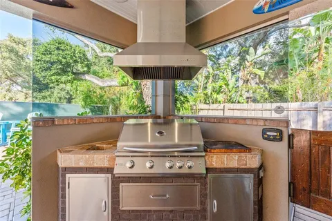 a stove top oven sitting inside of a kitchen