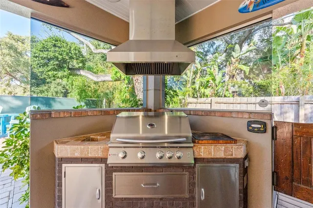 a stove top oven sitting inside of a kitchen