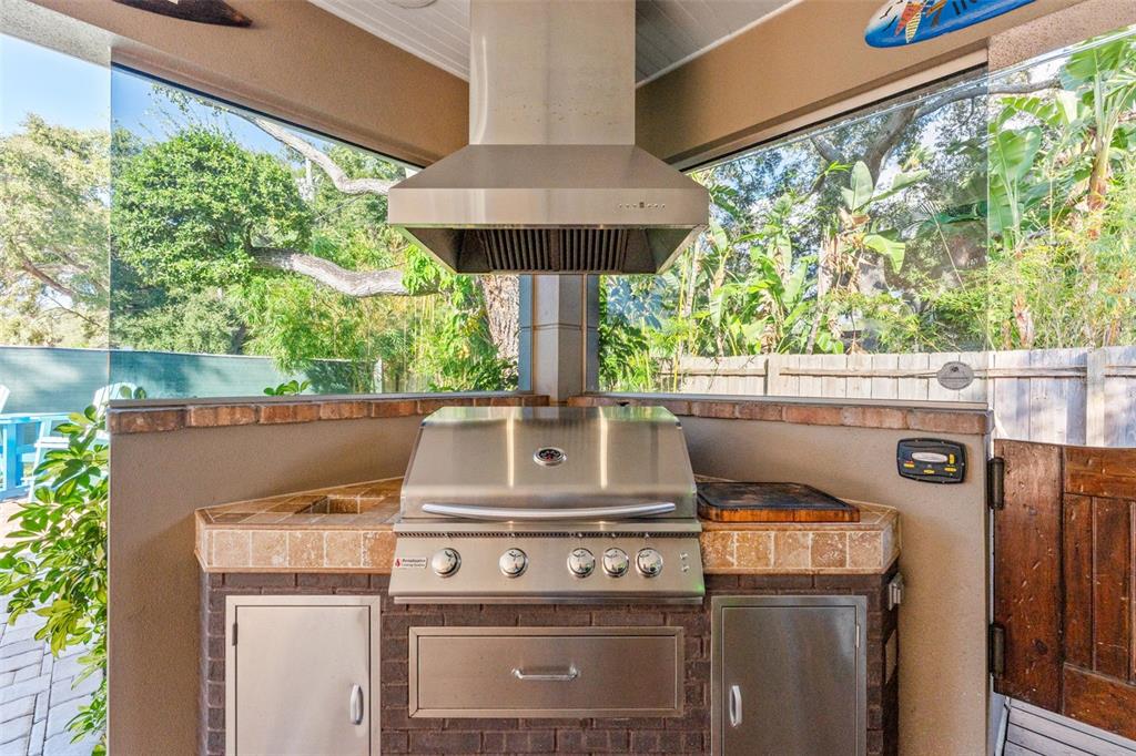 1441 Santa Anna Drive Dunedin, FL 34698 - Photo 25 of 34 a stove top oven sitting inside of a kitchen