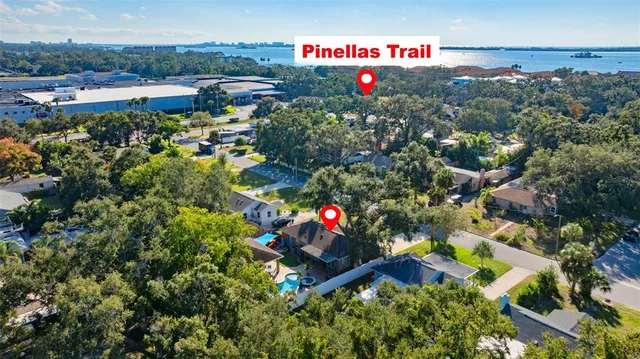 an aerial view of house with swimming pool