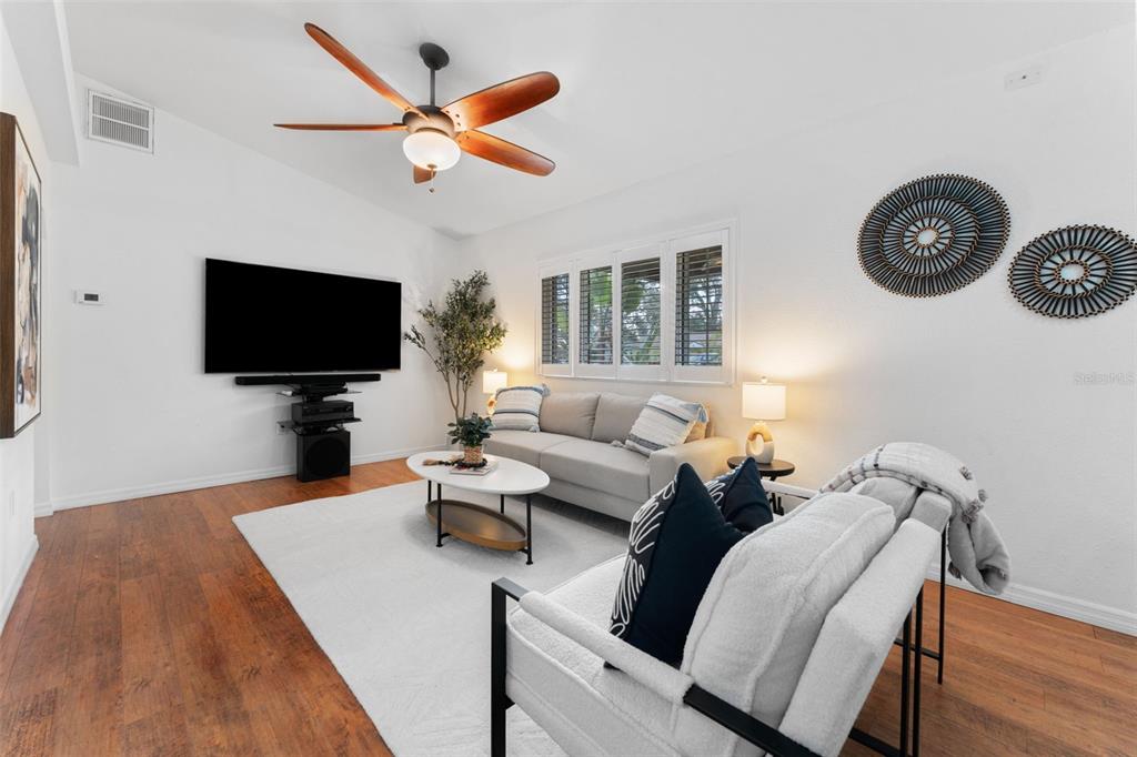 1441 Santa Anna Drive Dunedin, FL 34698 - Photo 6 of 34 a living room with furniture and a flat screen tv