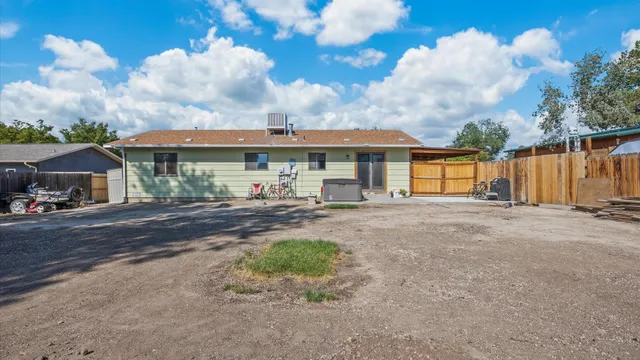 a view of a house next to a yard