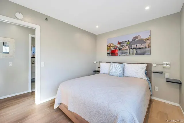 a large white bed in a white room