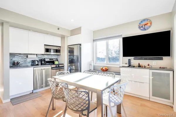 a kitchen with a stove a sink and a refrigerator