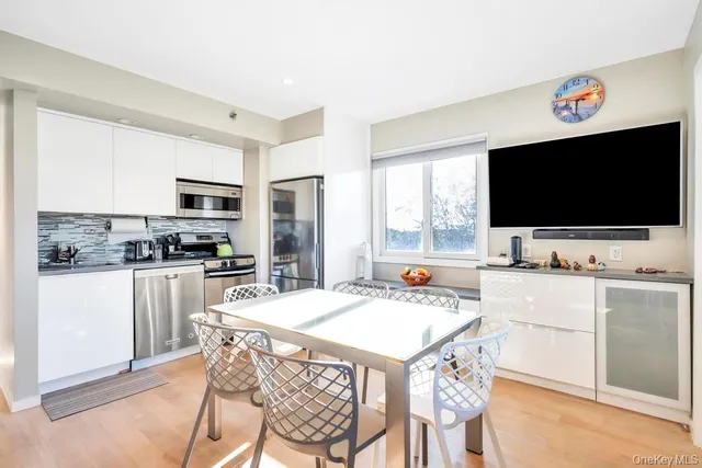 a kitchen with a stove a sink and a refrigerator