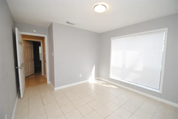 a bathroom with a granite countertop toilet a sink and a bathtub