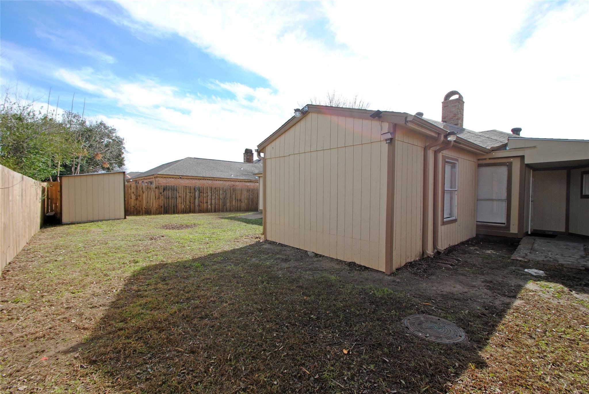 12802 Newbrook Drive Houston, TX 77072 - Photo 16 of 17 a view of a house with a yard
