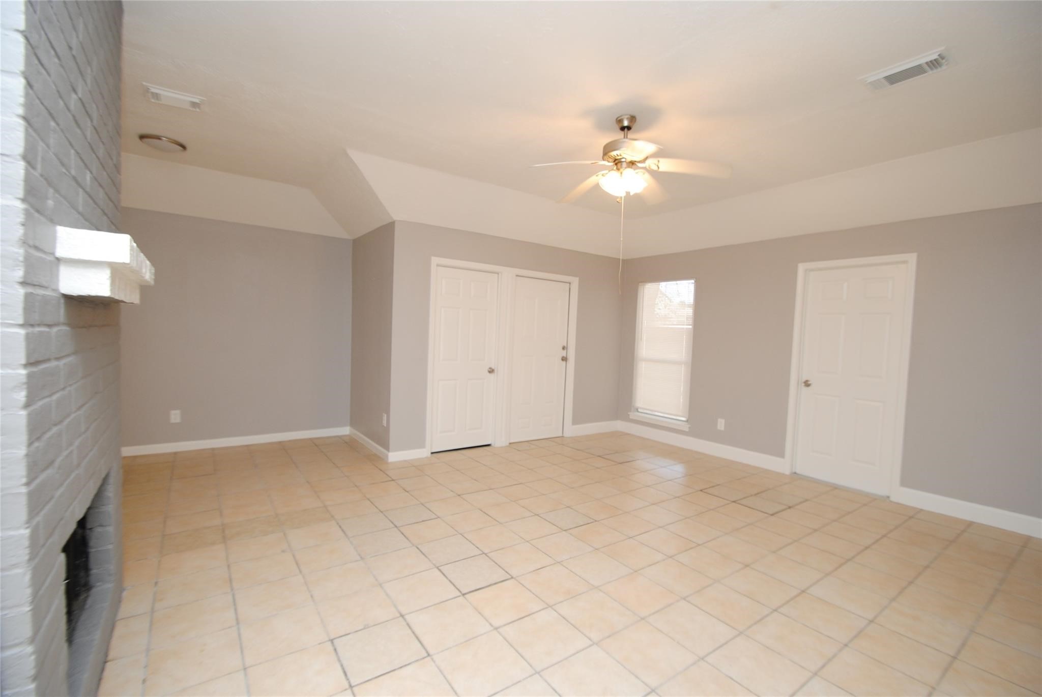 12802 Newbrook Drive Houston, TX 77072 - Photo 4 of 17 a view of an empty room with a window