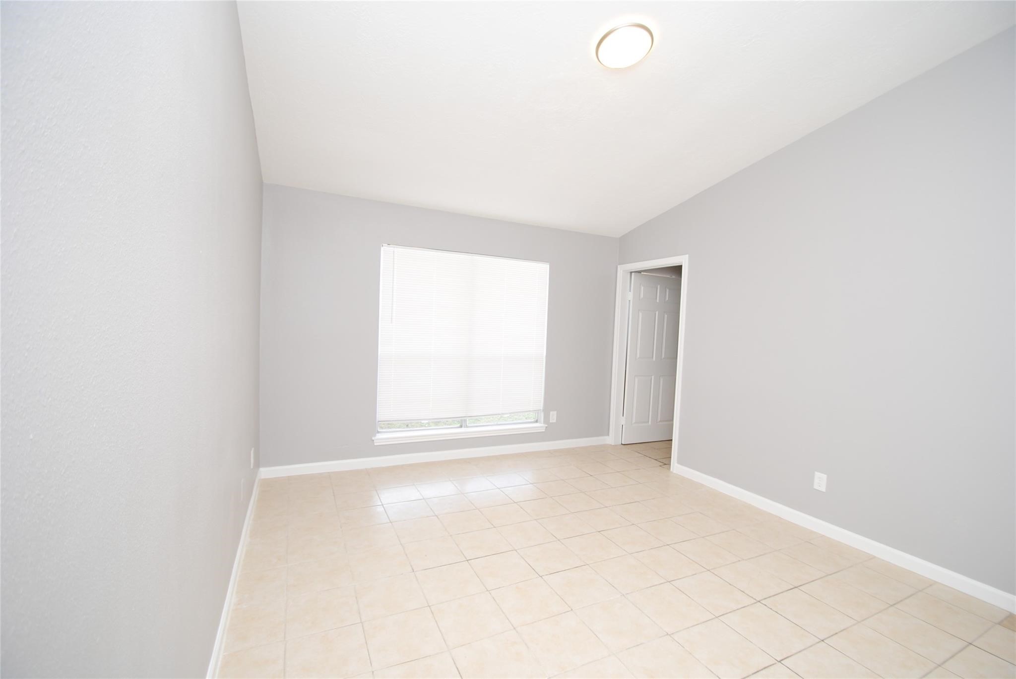 12802 Newbrook Drive Houston, TX 77072 - Photo 8 of 17 a view of an empty room with a window