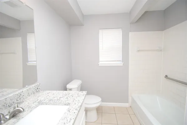 a bathroom with a toilet and a sink