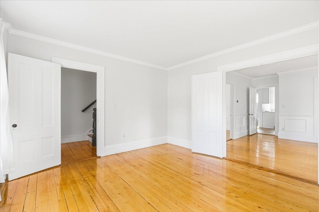 16 Howard Avenue Holbrook, MA 02343 - Photo 11 of 40 a bedroom with a bed and wooden floor
