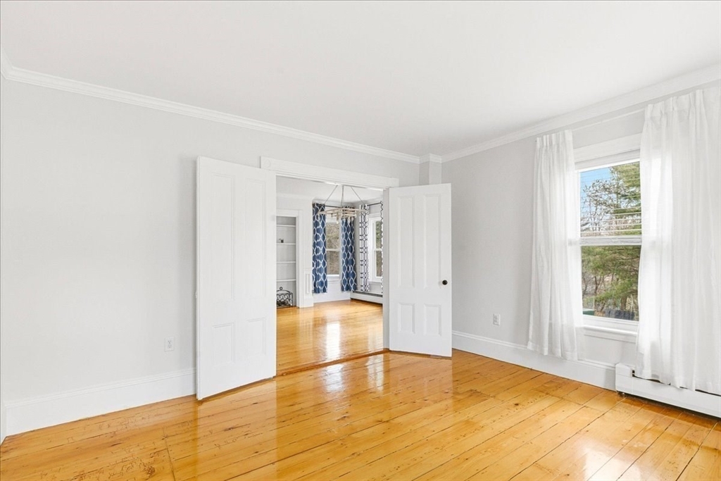 16 Howard Avenue Holbrook, MA 02343 - Photo 12 of 40 a view of empty room with wooden floor and fan