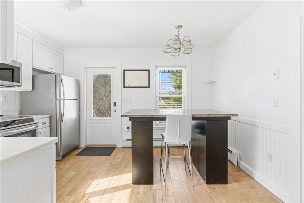 16 Howard Avenue Holbrook, MA 02343 - Photo 21 of 40 a kitchen with stainless steel appliances a refrigerator and a stove top oven
