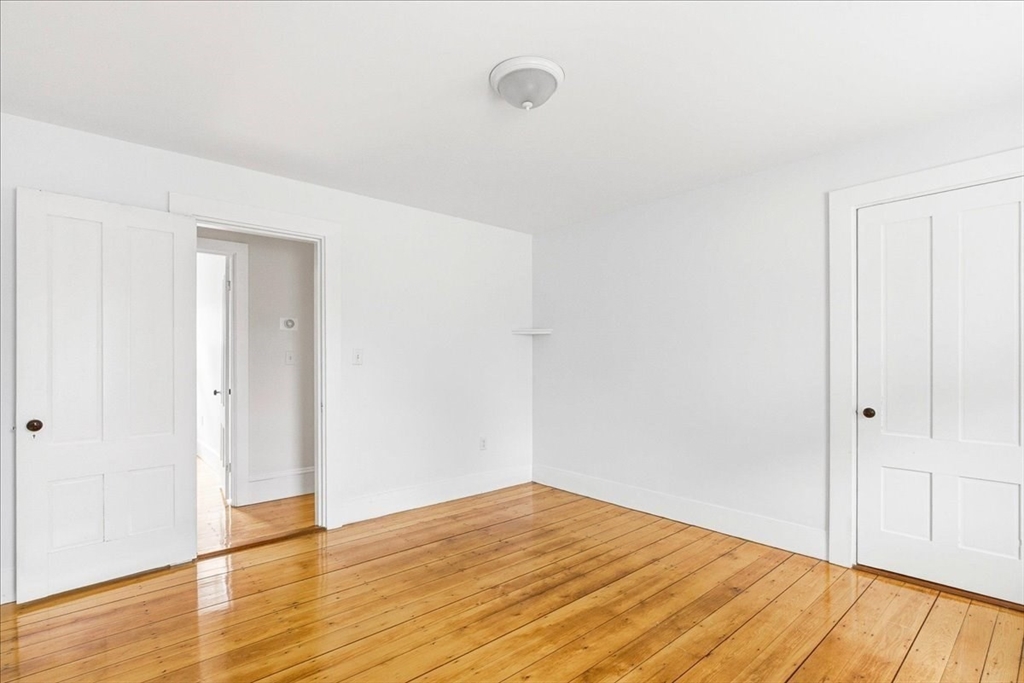 16 Howard Avenue Holbrook, MA 02343 - Photo 28 of 40 a view of empty room with wooden floor