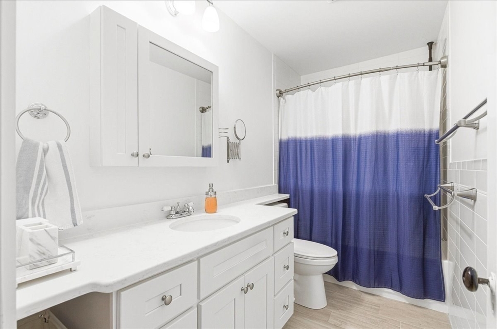 16 Howard Avenue Holbrook, MA 02343 - Photo 34 of 40 a bathroom with a sink a toilet and shower