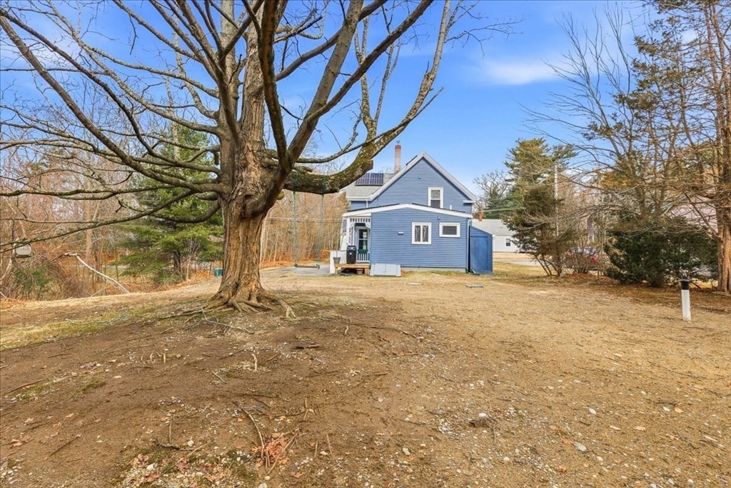 16 Howard Avenue Holbrook, MA 02343 - Photo 39 of 40 a house with a trees back side of it