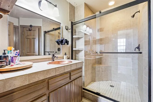 a bathroom with a sink and a mirror