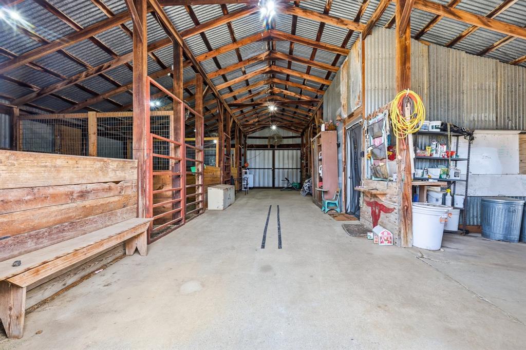 309 Sanders Road Denton, TX 76210 - Photo 26 of 40 a view of an empty room with wooden walls