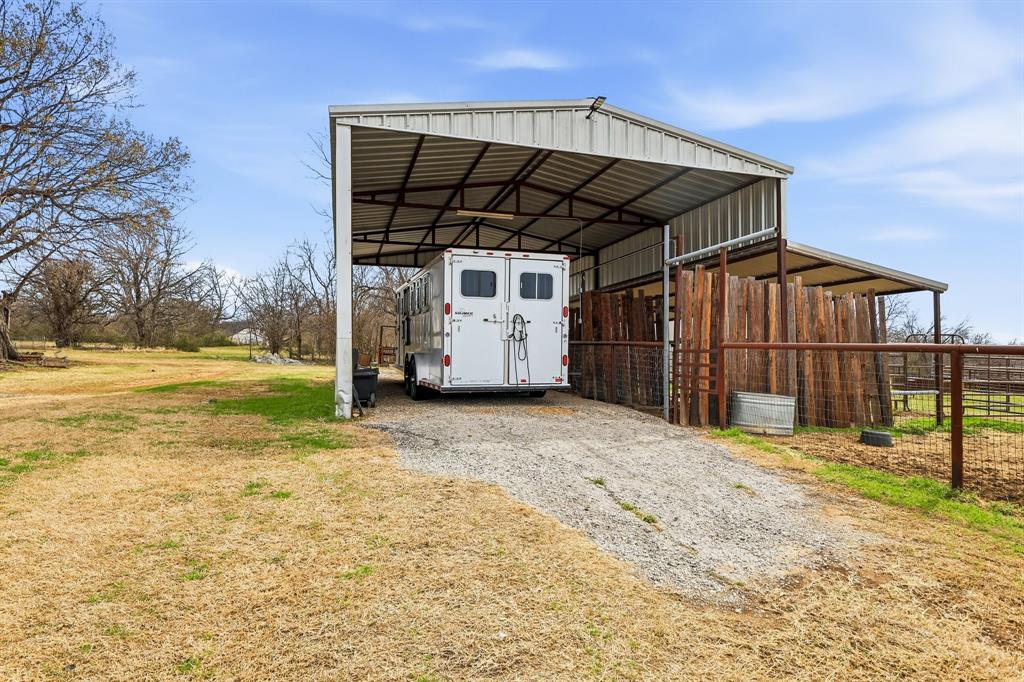 309 Sanders Road Denton, TX 76210 - Photo 33 of 40 a view of a house with backyard and wooden fence