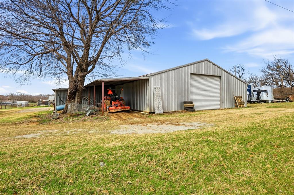 309 Sanders Road Denton, TX 76210 - Photo 36 of 40 a view of a house with backyard and tree